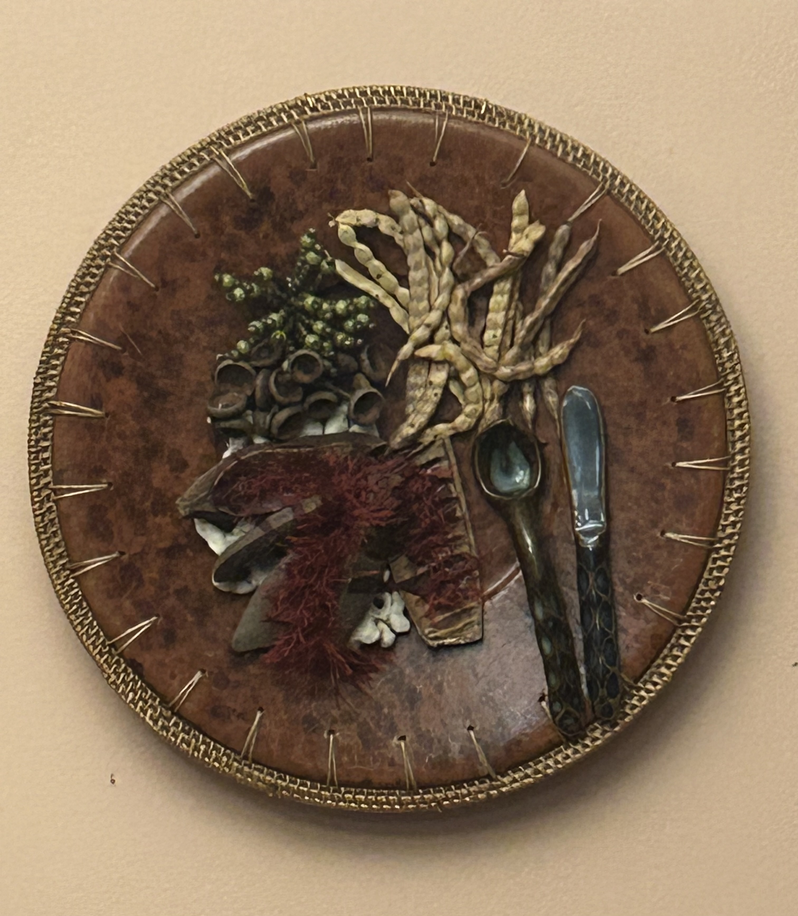 Woks of Life — round mixed-media assemblage